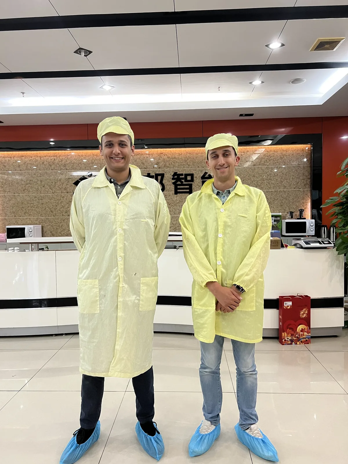 Insyght team in cleanroom suits at manufacturing facility