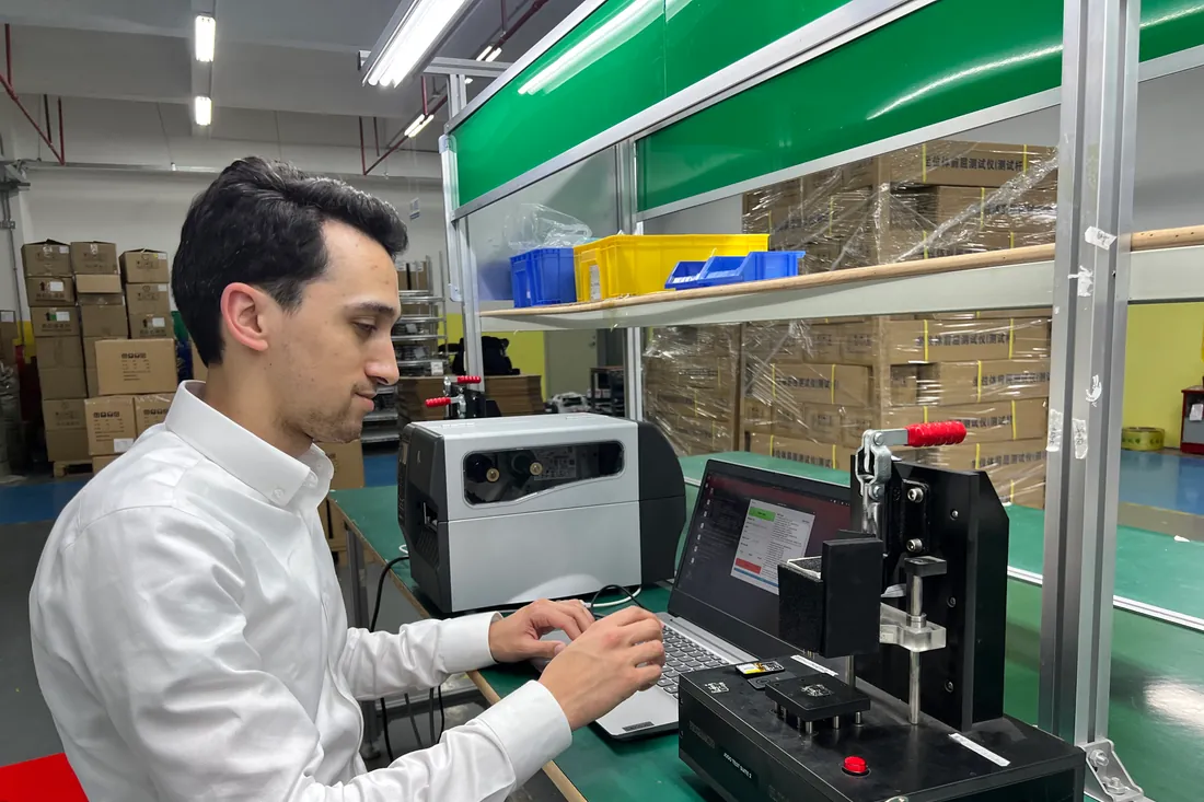 The production test and label printing setup on the factory floor
