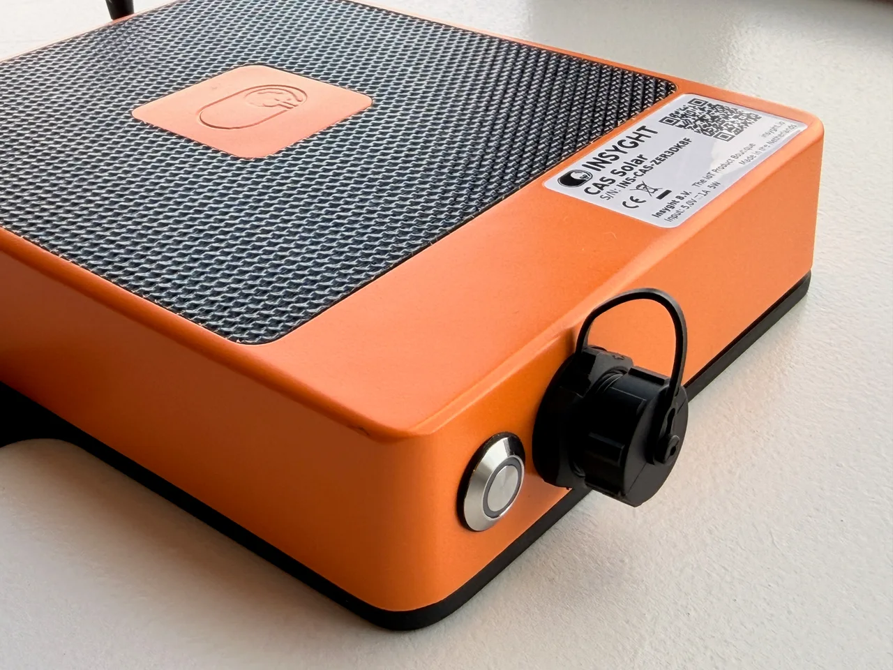Close-up of the orange CAS Solar enclosure and covered external connection