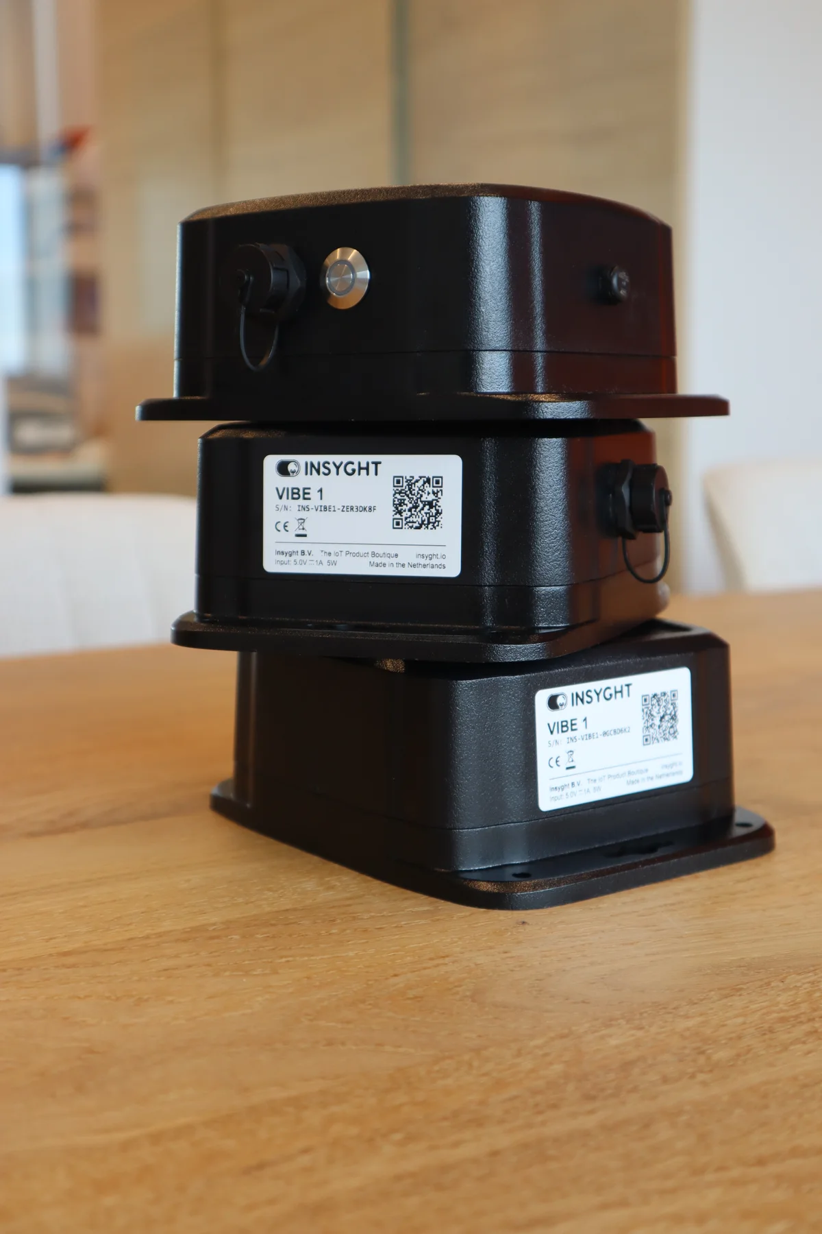 Three black Insyght Vibe sensors from the first product series